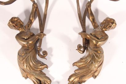 null Pair of gilded metal sconces with two light arms depicting bathers and foliage

Circa...
