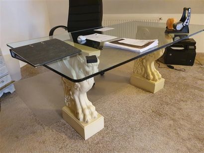 null Desk with plaster base featuring winged lions, glass top

twentieth century

100...