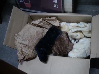 null In a cardboard box, set of furs, fur coats

Two leather suitcases are included...