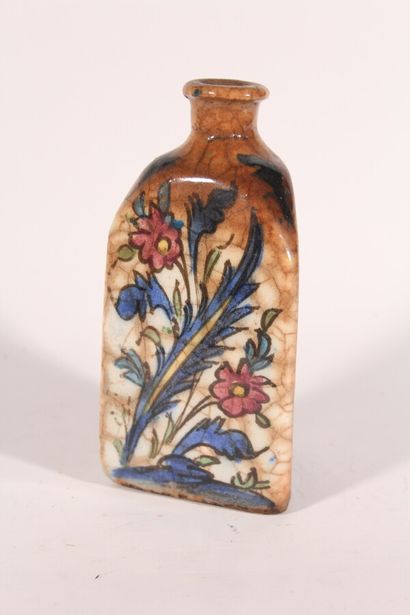 null Stoneware bottle in the Iznik taste with portrait and flower decoration

nineteenth...