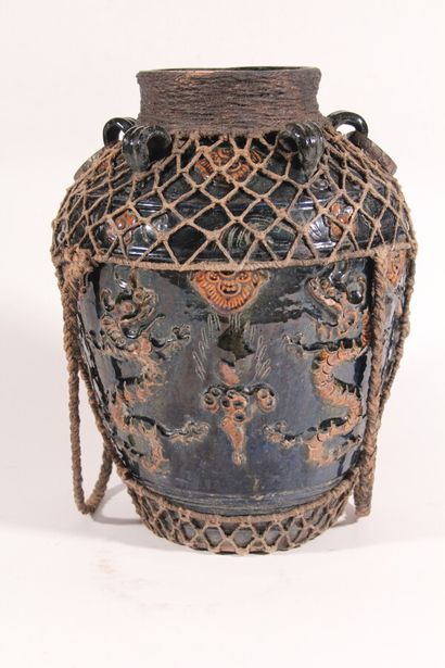 null Enamelled stoneware vase with handles decorated in relief with dragons 

South...