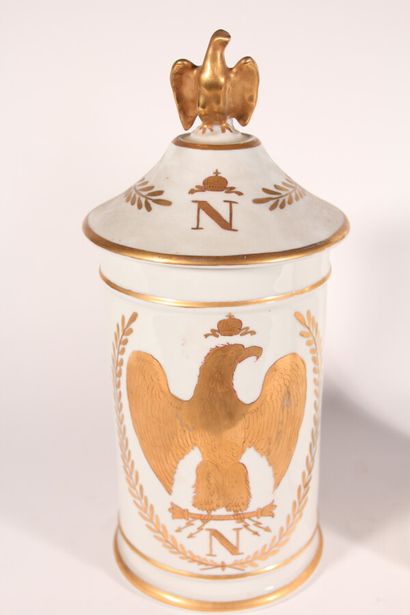 null Two white porcelain medicine jars with gold fillets, one with gilded decoration...
