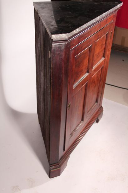 null Small corner piece of furniture in stained wood and molded, opens to a door,...