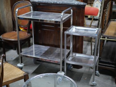 null Two ends of sofa, chrome tube frame, glass top

Circa 1970

Two hospital sideboards...
