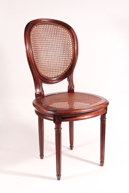 null Ten dining room chairs, cane chairs, convertible backrest, upholstered seat.

Louis...
