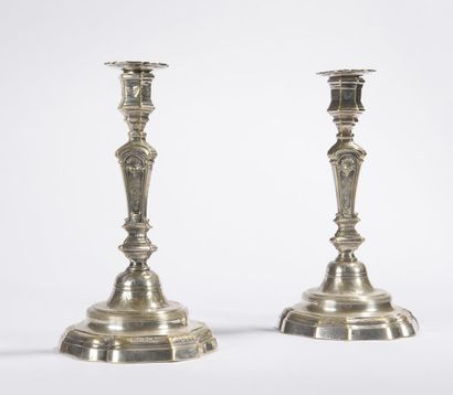 null Pair of silver plated brass torches, scrolled base decorated with feathers and...