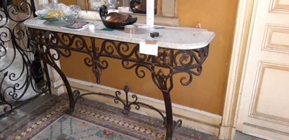 null Wrought and hammered iron console with scroll decoration and fleurons, white...