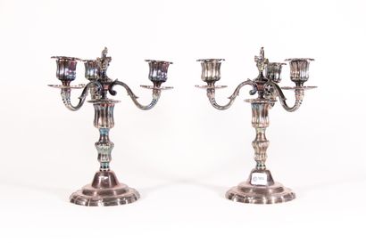 null A pair of 19th century silver plated bronze candlesticks, the base with fillets,...