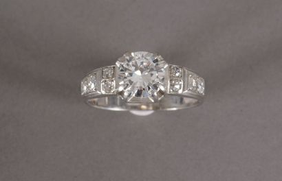 null Platinum ring set with a half-cut diamond weighing approximately 1.40 carats,...