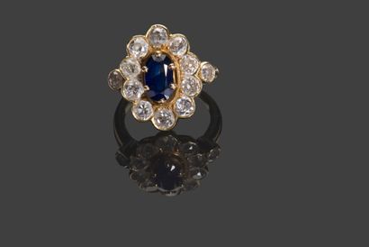 null Ring pompadour in yellow gold 750 thousandth set with a central oval sapphire...