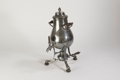null A late 19th century silver plated tea fountain. It rests on three feet with...