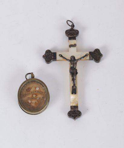null A mother-of-pearl and silver crucifix pendant, 19th century, with a small silver...