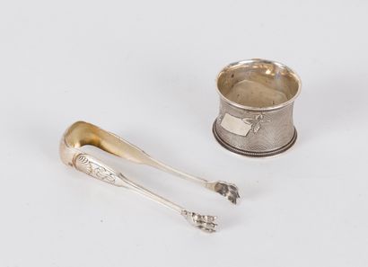 null A small silver sugar tongs Minerve 950 thousandths with legs of lion and shells,...