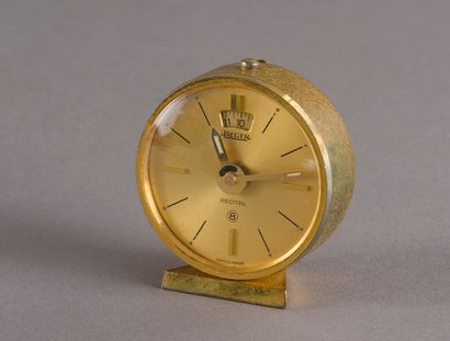 null Jaeger, circa 1960, gilt brass travel alarm clock model Recital, round case...