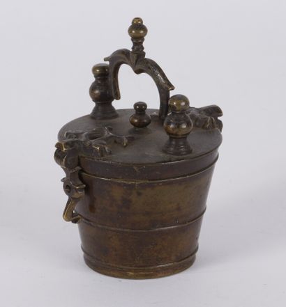 null A Charlemagne bronze weight, the lid and handle decorated with scrolls, hasp...