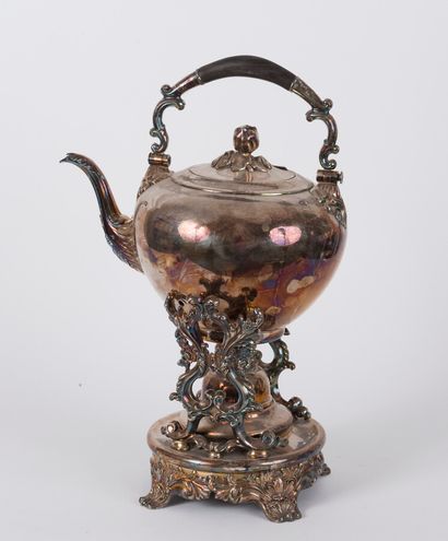 null An important Napoleon III silver plated tea fountain. It rests on a round quadripod...