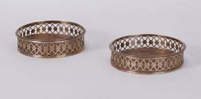 Two round silvered metal coasters with pierced...
