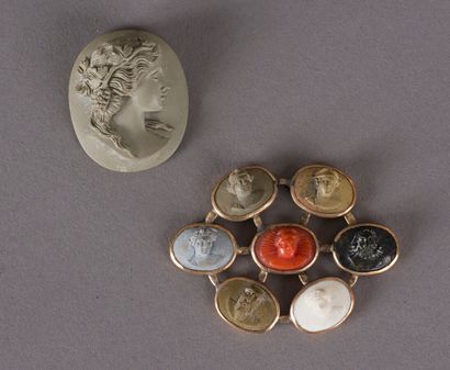 null Oval element in vermeil set with six cameos in limestone falsely called lava...