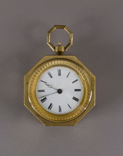 null Small brass alarm clock, octagonal, the bezel decorated with a frieze of water...