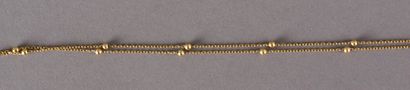 null Chain in yellow gold 750 thousandths decorated with small gold pearls 2,4 g...