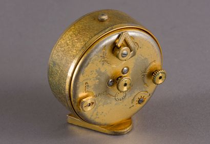 null Jaeger, circa 1960, gilt brass travel alarm clock model Recital, round case...
