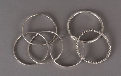 null Four silver bracelets, three linked, one twisted and one half-linked, 86.6 ...