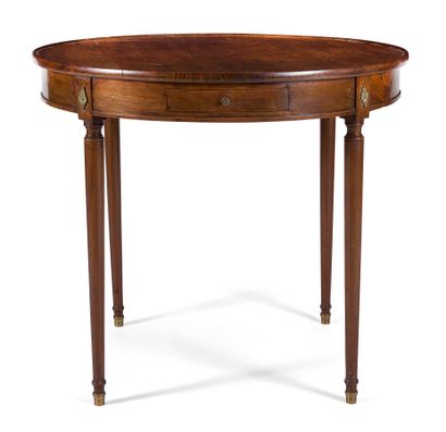 null CIRCULAR MAHOGANY TABLE

the top with edge resting on a belt opening to two...