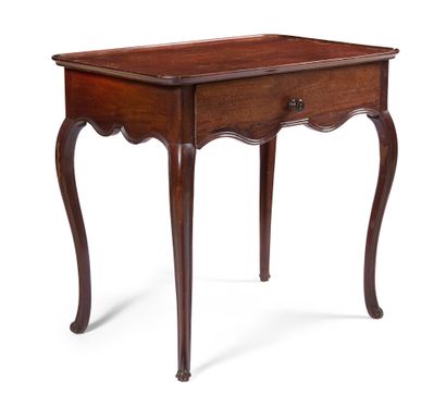 null MAHOGANY CABARET TABLE WITH MOULDING

opening to a drawer, resting on cambered...