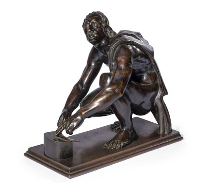 null BRONZE FIGURE WITH BROWN PATINA

representing L'Arretino after the Antique.

Late...