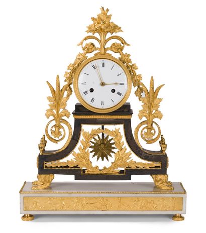 null CLOCK IN WHITE MARBLE, BLACKENED BRASS AND GILDED BRONZE 

decorated with a...