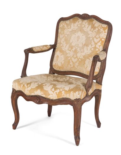 null WALNUT ARMCHAIR, MOULDED AND CARVED

with flat back and decoration of foliage...