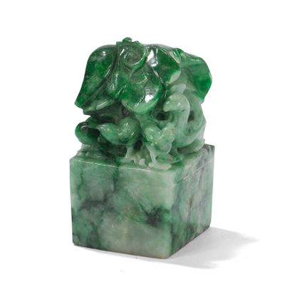 null TWO JADEITE SEALS

China, 20th century.

Square section, the grip of one carved...