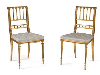 null PAIR OF CHAIRS IN CARVED AND GILDED WOOD

back with bars, fluted legs, upholstered...