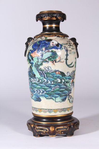 null Ceramic vase enamelled with a lively scene of characters, European bronze frame

China,...