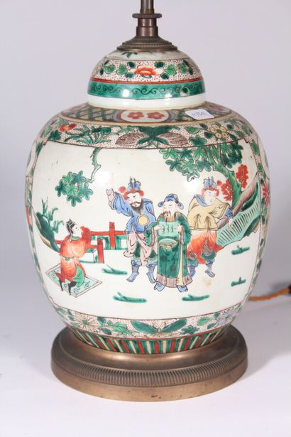 null Porcelain covered pot with polychrome decoration of flowers and characters

Mounted...