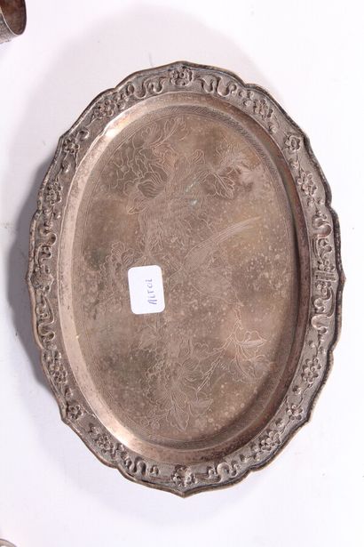 null Small oval silver plated tray with chased decoration of birds. 

Six silver...
