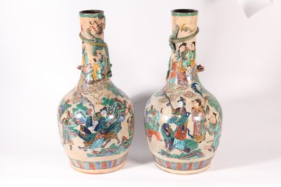 null Pair of cracked and glazed ceramic vases decorated with characters and a dragon...