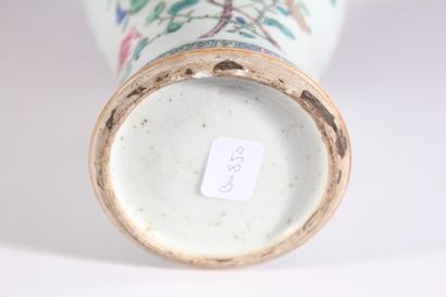 null Porcelain vase with polychrome decoration of peonies and Buddhist attributes...