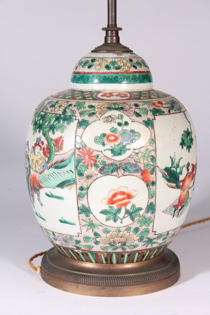 null Porcelain covered pot with polychrome decoration of flowers and characters

Mounted...