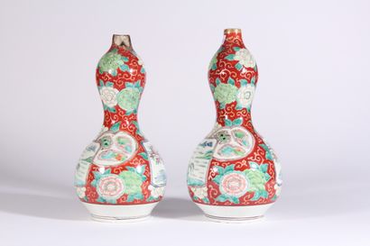 null Pair of porcelain double gourd vases with polychrome decoration of landscape...