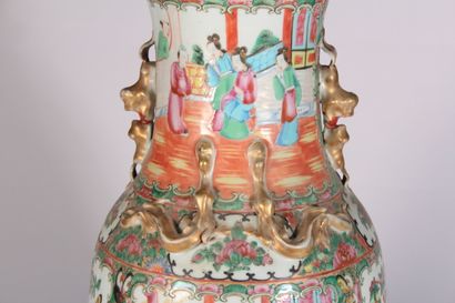 null Canton porcelain vase of baluster form decorated with palace scenes, butterflies...