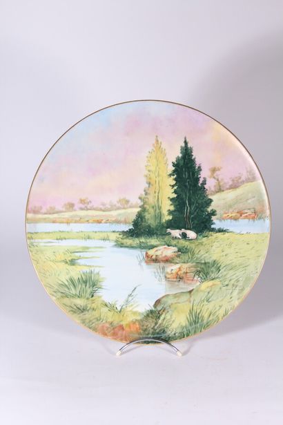 null Large decorative porcelain dish, full decoration of a lake landscape signed...