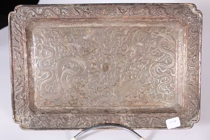 null Silver plated tray with chased dragons hunting the sacred pearl

Japan, circa...