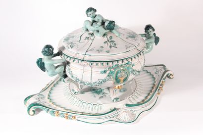 null Large earthenware tureen and its display stand decorated with cherubs in rocaille...