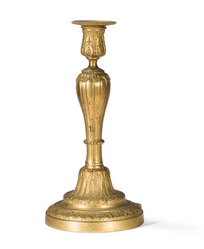 null Gilt bronze candlestick decorated with palmettes, interlacing and foliated friezes,...