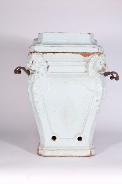 null Small enamelled terracotta stove with lion's head design, wrought iron handles...