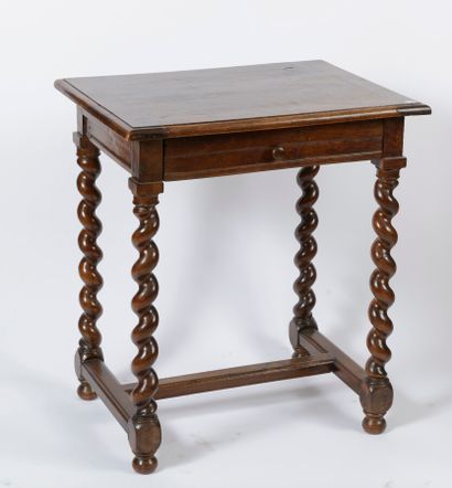 null A small moulded and carved walnut table opening with a drawer, resting on four...