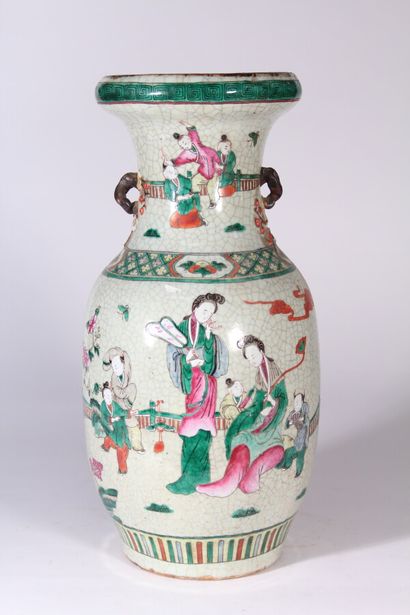null A Nanking glazed stoneware vase with polychrome decoration of characters

Southern...