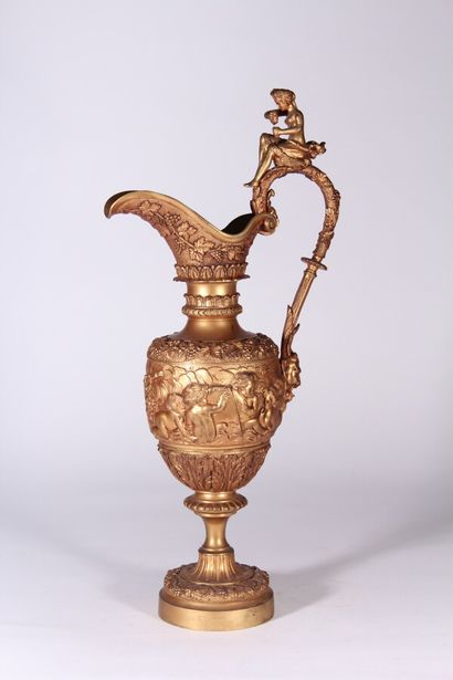 null A large ormolu ewer with a revolving decoration of love birds and friezes of...