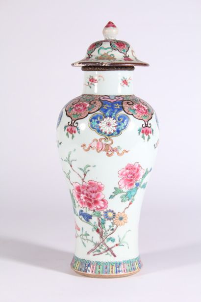 null Porcelain vase with polychrome decoration of peonies and Buddhist attributes...